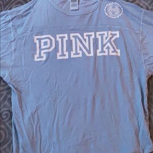 A pastel blue PINK shirt